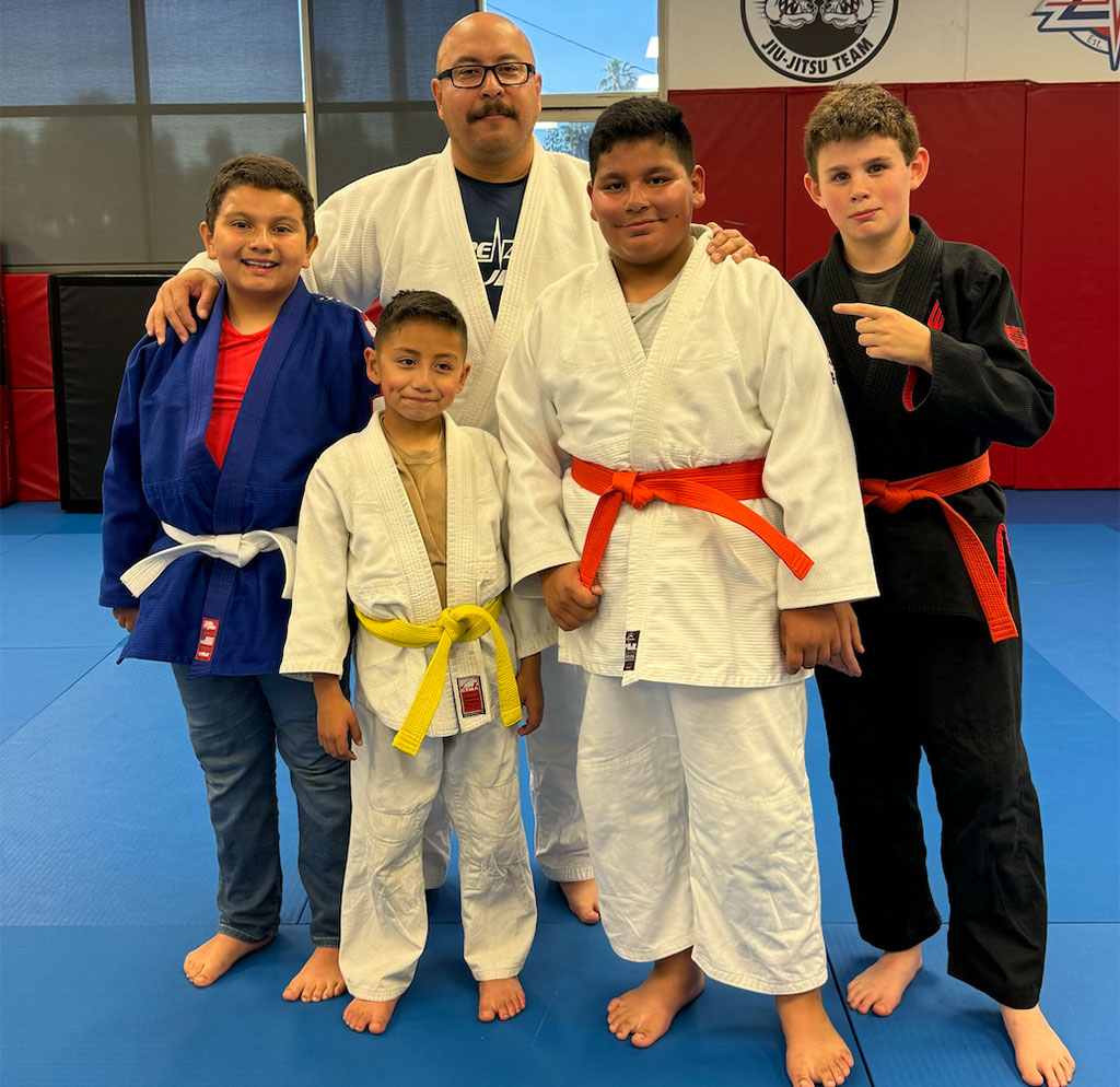 Paul Rodriguez celebrates his Judo promotion with Sensei Jesse Duran